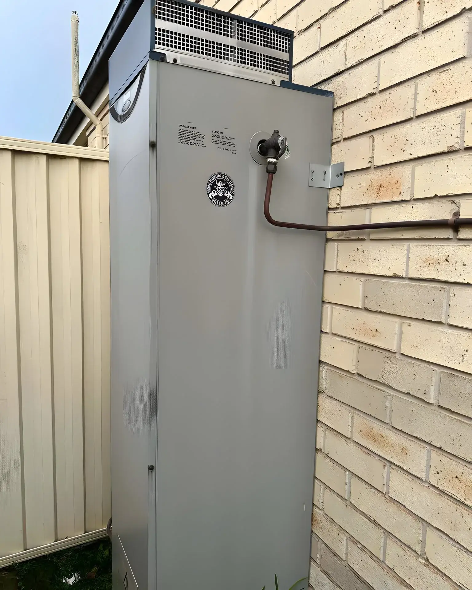 Twenty-year gas storage unit on the wall, before the G-series swap