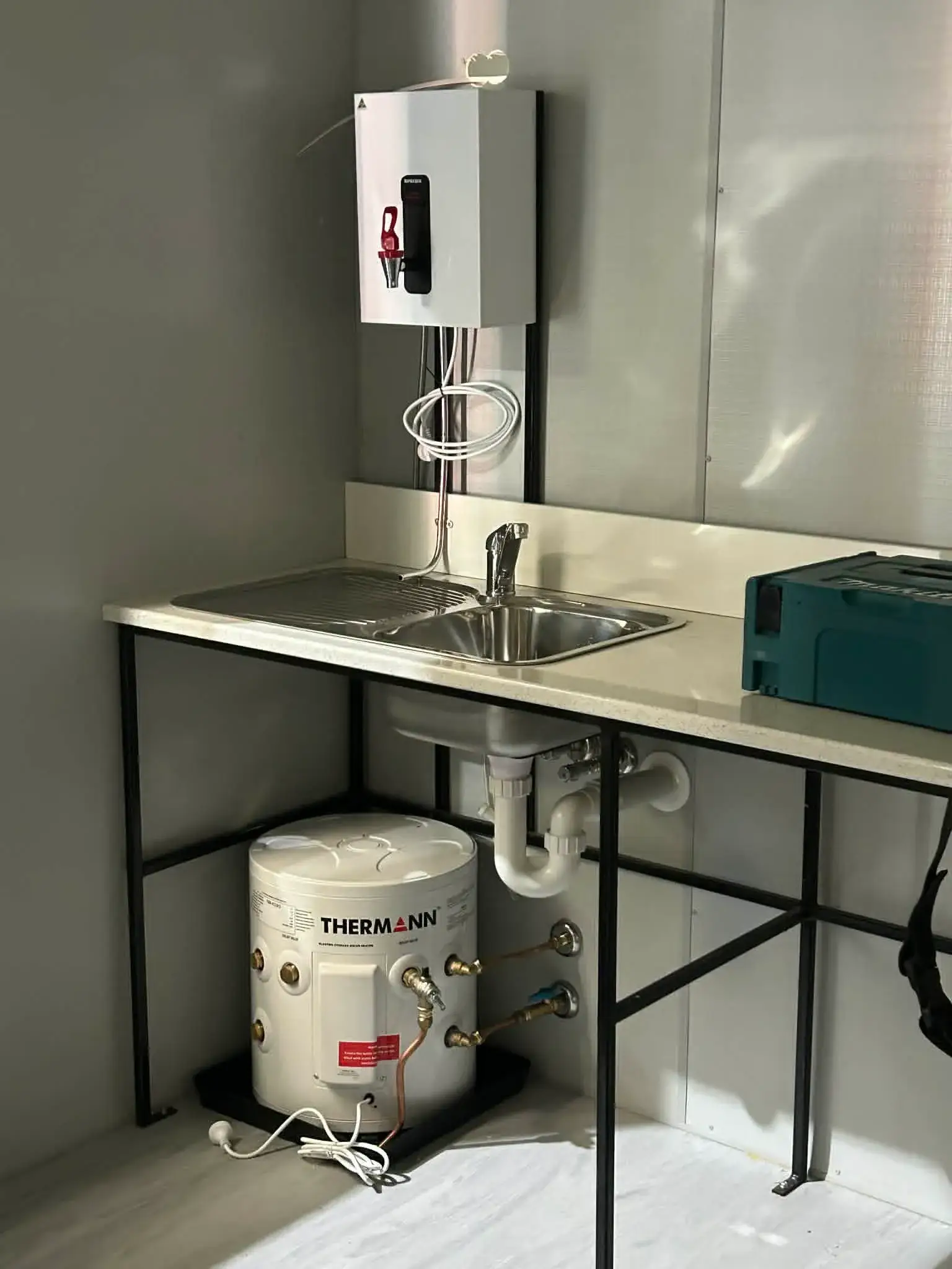 Site kitchenette: stainless sink and under-bench Thermann storage
