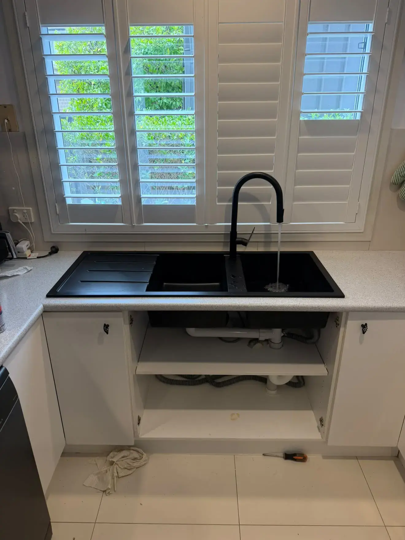 New black sink, drainer and mixer fitted into the modified bench top, Balcolyn.