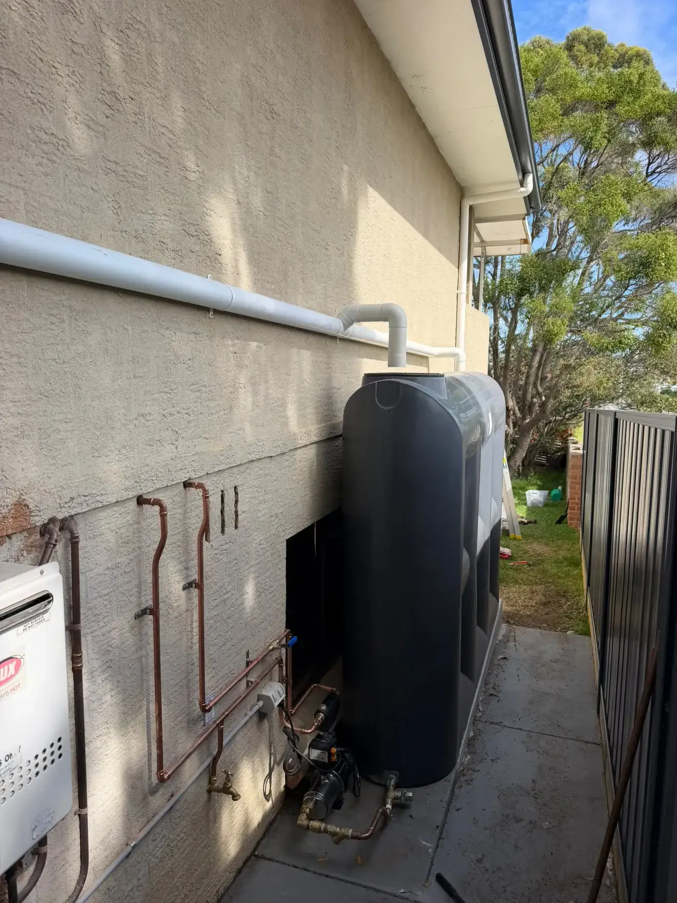 Rainwater pump with its pressure control switch, and the new yard tap, Bateau Bay.