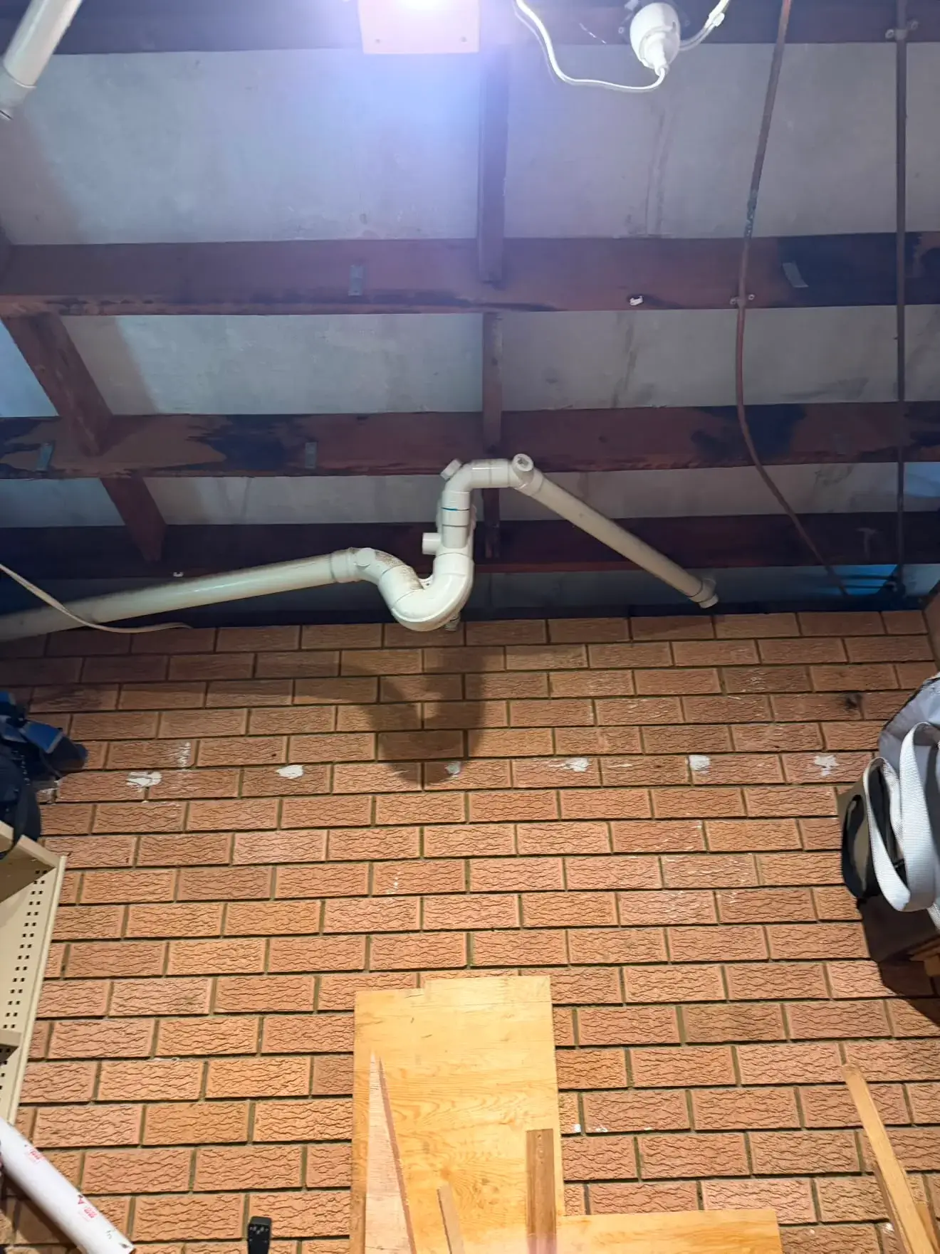 Stack drainage run through the framing overhead, Bateau Bay.