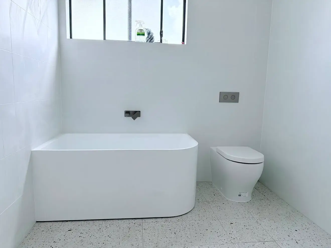 Freestanding bath and black wall spout, Gwandalan.