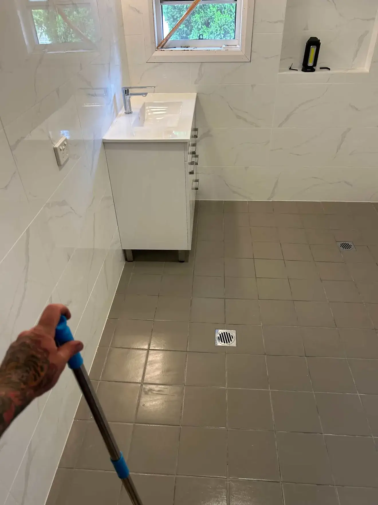Bathroom in Kahibah: vanity, basin mixer and two floor wastes.