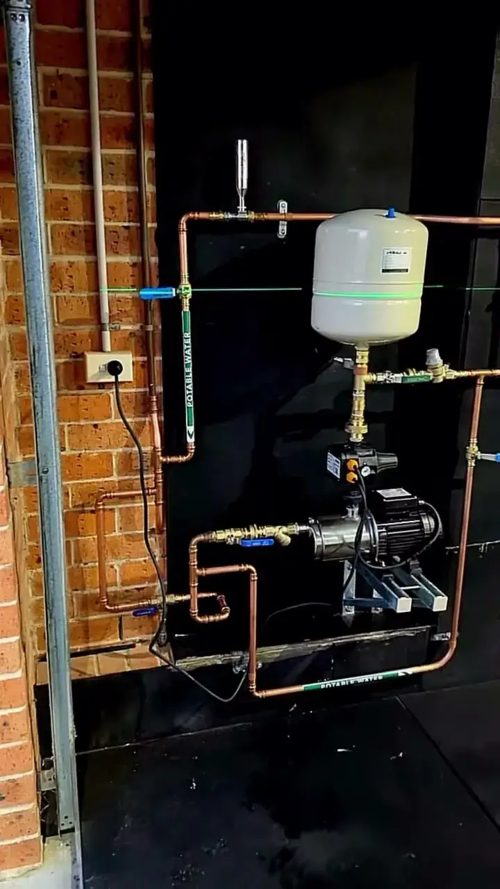 Mains-pressure pump and pressure vessel, isolation valves and potable labels.