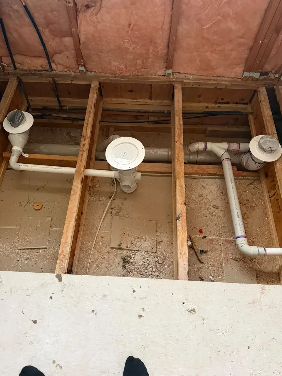 Floor waste, pan connector and vent set between the floor joists, Wyee Point.