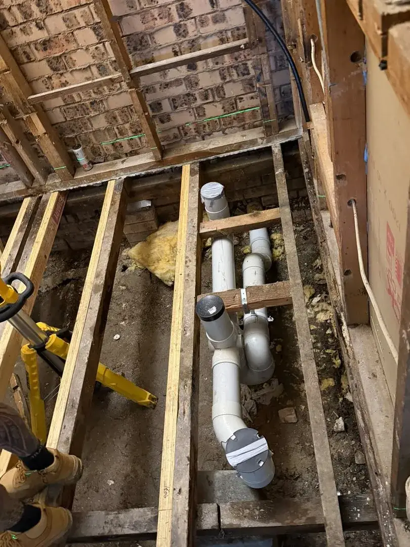 Drainage rough-in through the sub-floor of an older brick home, Lake Munmorah.