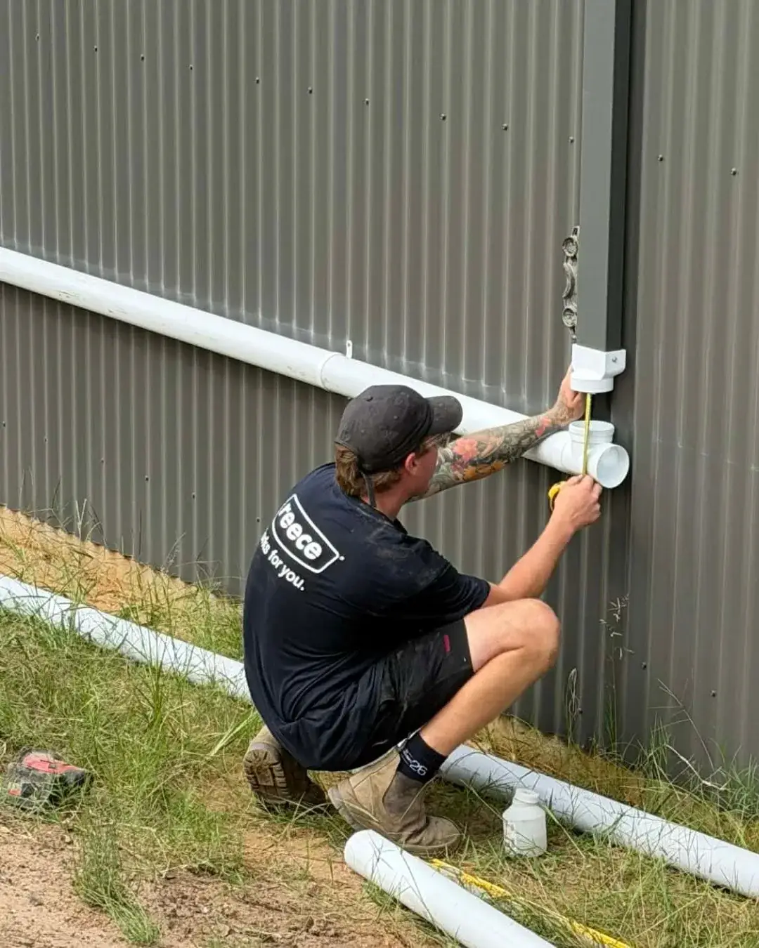 Stormwater junction on a colorbond wall