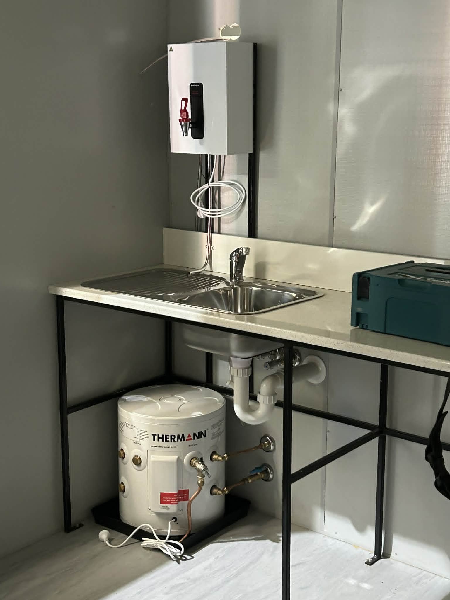 Site kitchenette: stainless sink and under-bench Thermann storage