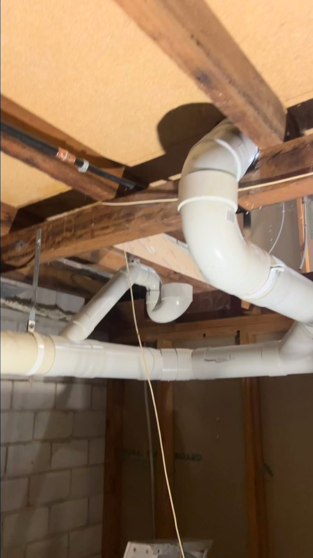 Underfloor waste pipework through timber joists