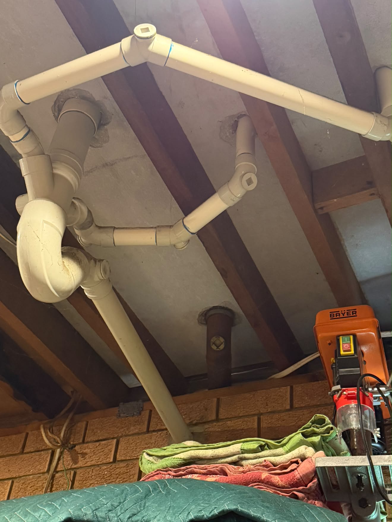 Stack renewal in the garage: traps set for the bathroom, powder room and laundry above.