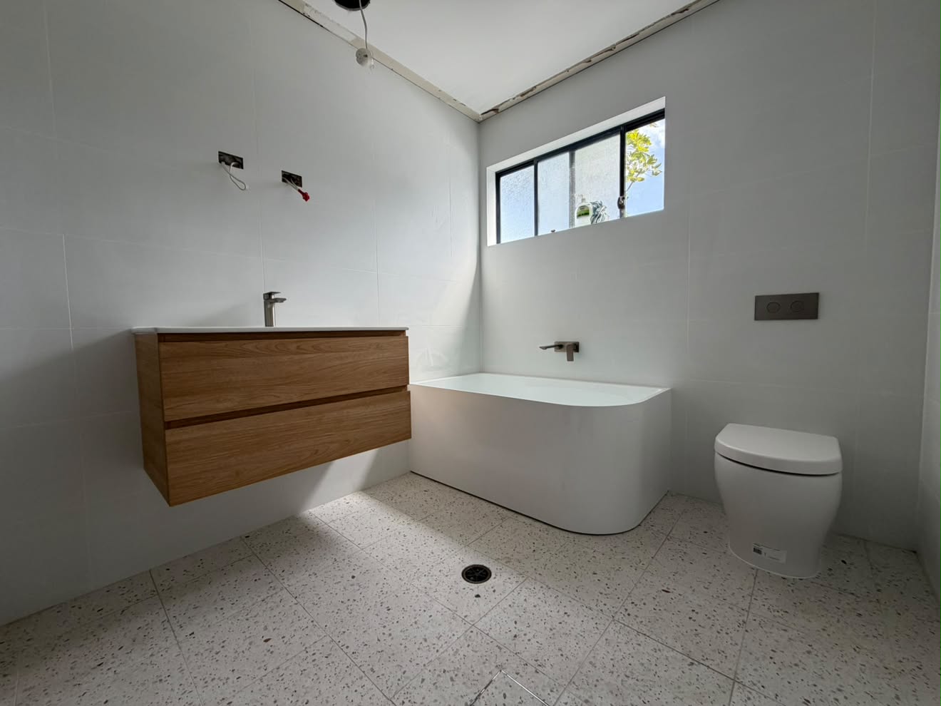 Vanity, bath and toilet at fit-off, Gwandalan.