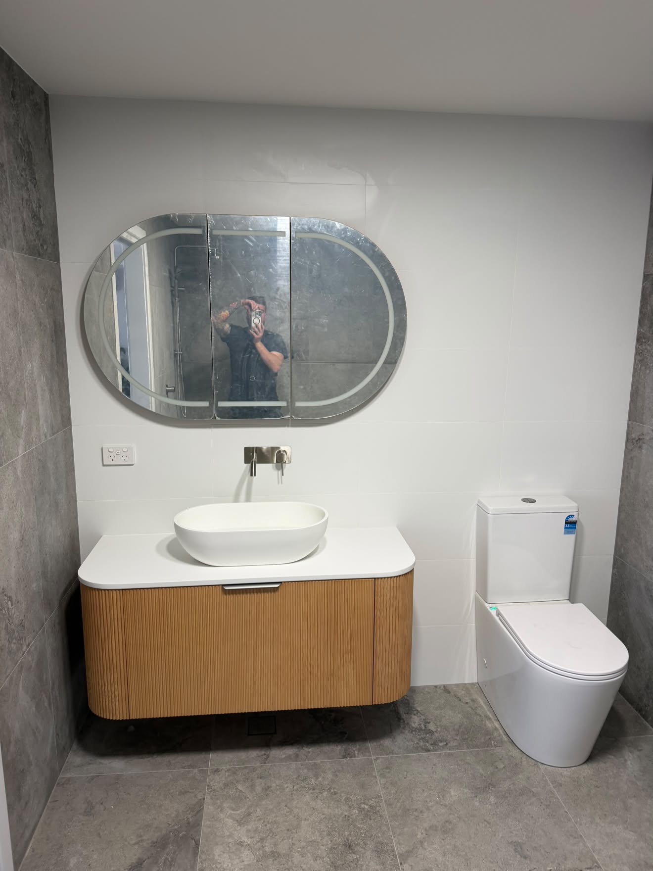 Finished Lake Munmorah bathroom: fluted timber vanity, vessel basin and wall mixer
