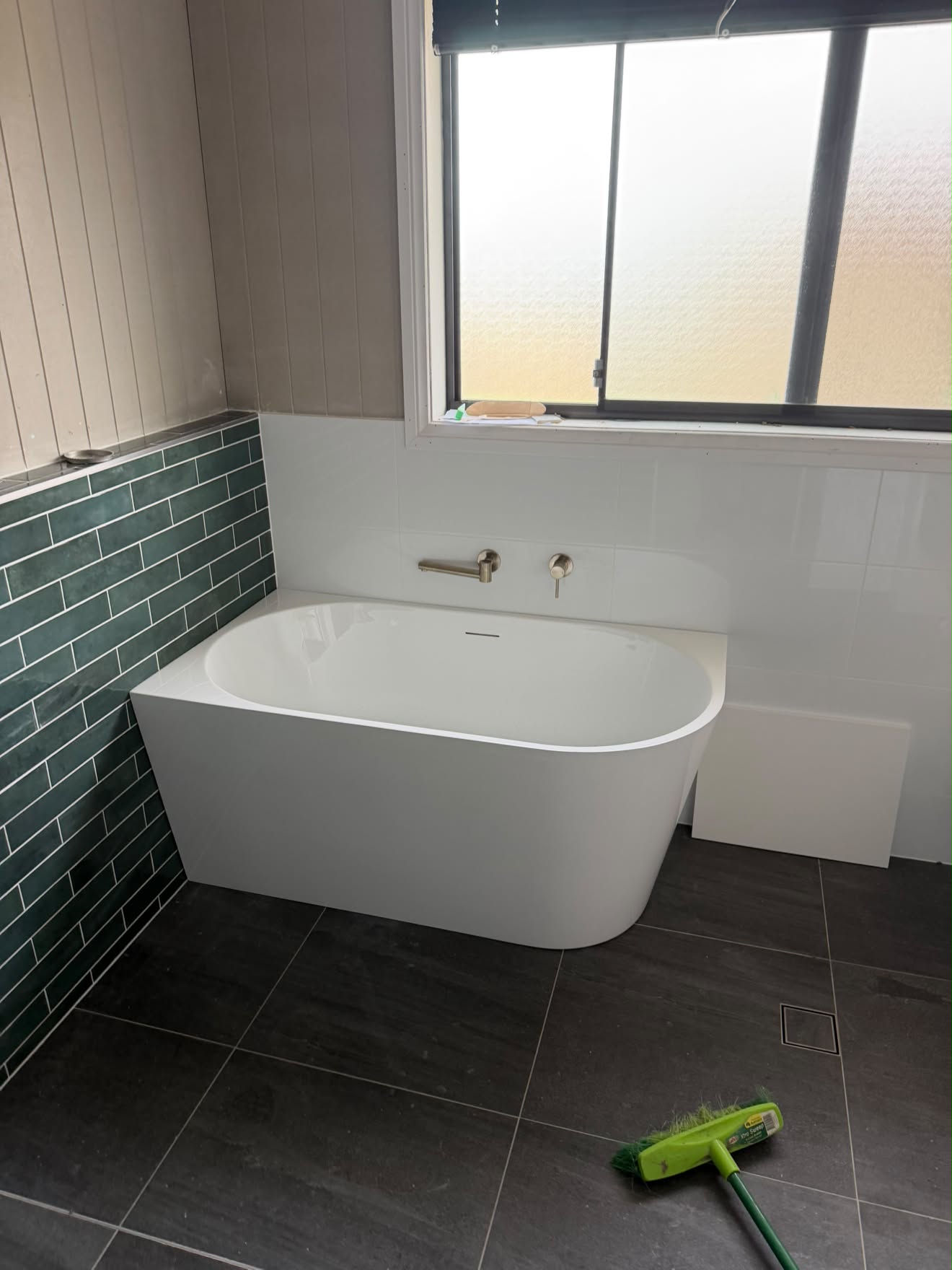 Freestanding bath against green subway tile, Wyee Point.