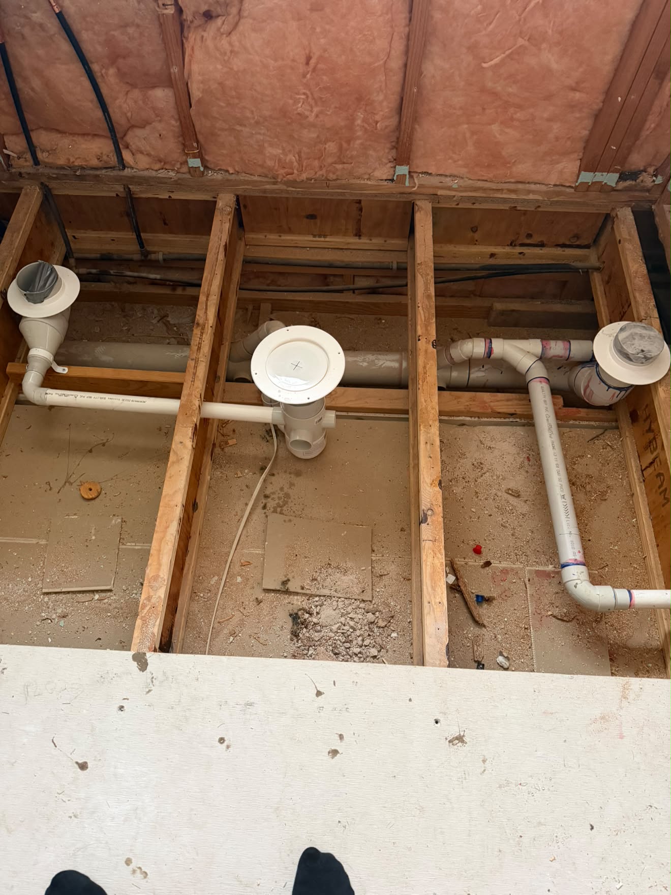 Wastes and floor drain set between the joists, Wyee Point bathroom.