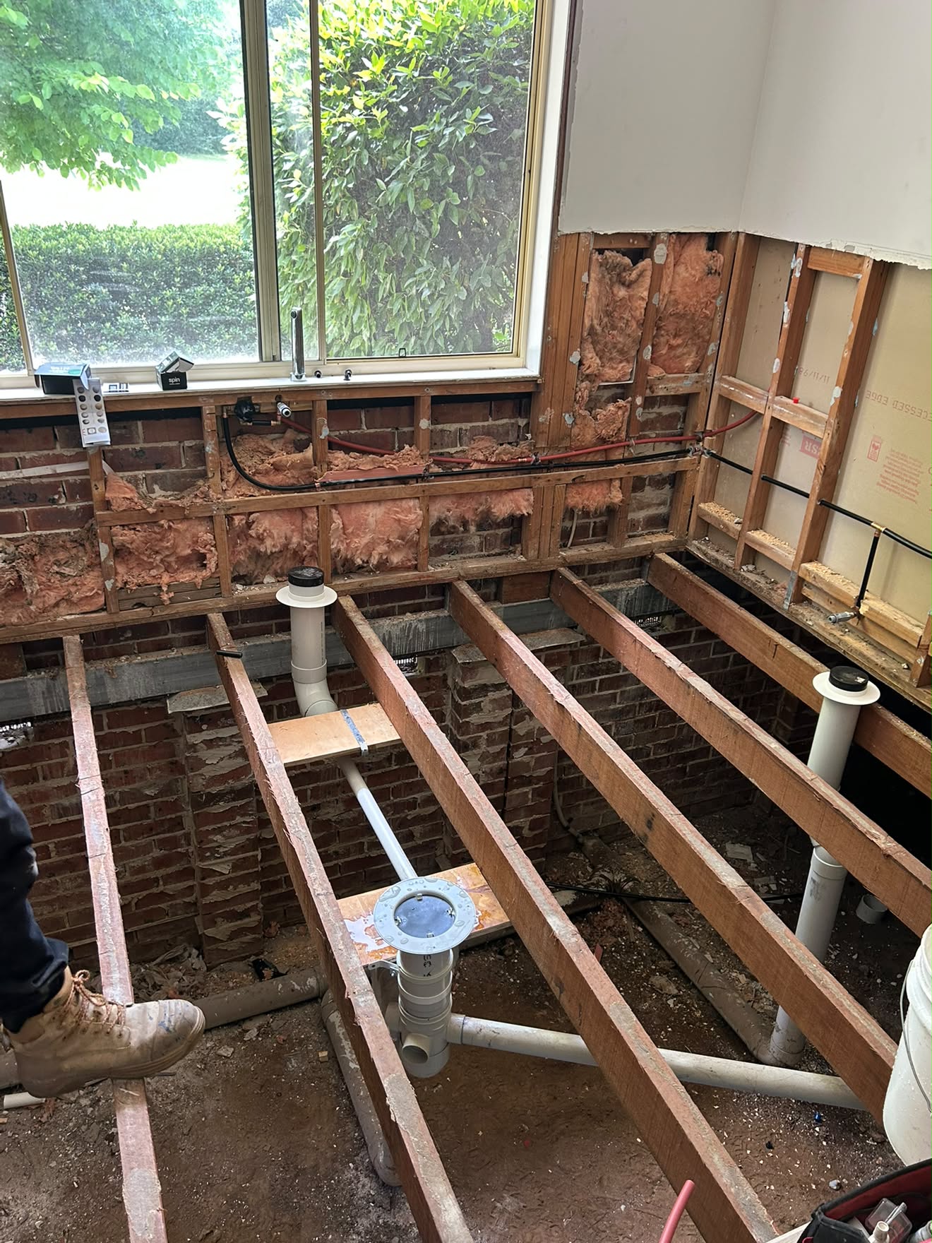 Open floor joists and drainage rough-in under the bathroom window, Yarramalong