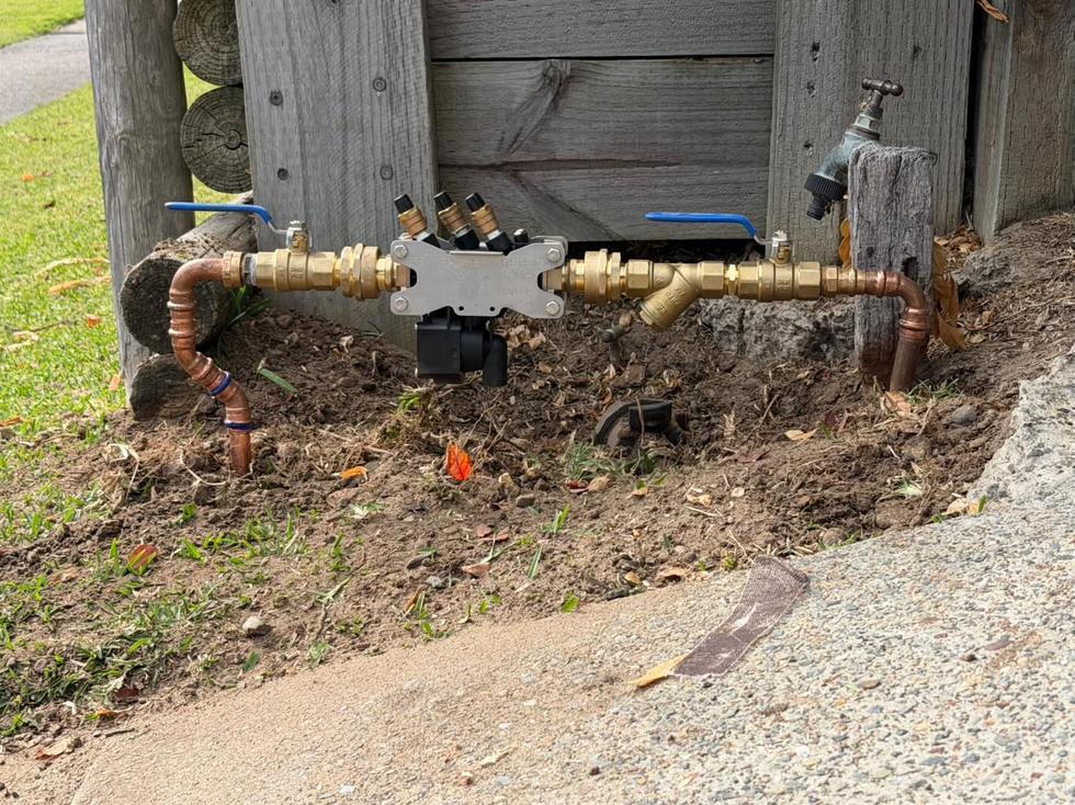 Testable backflow prevention device installed on the water service at the property boundary.