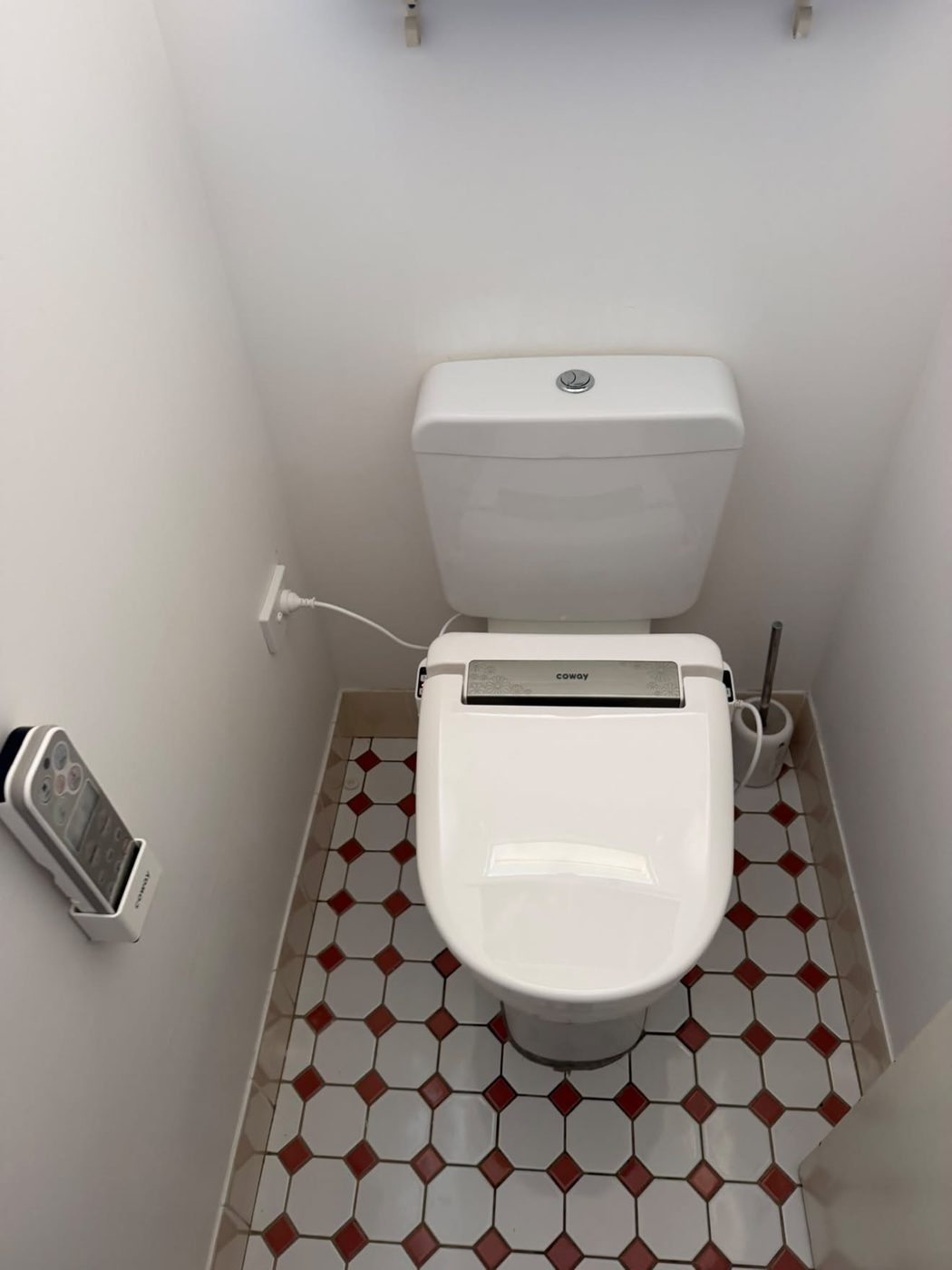 Heated bidet seat retro-fitted to an existing suite, water and power connected.