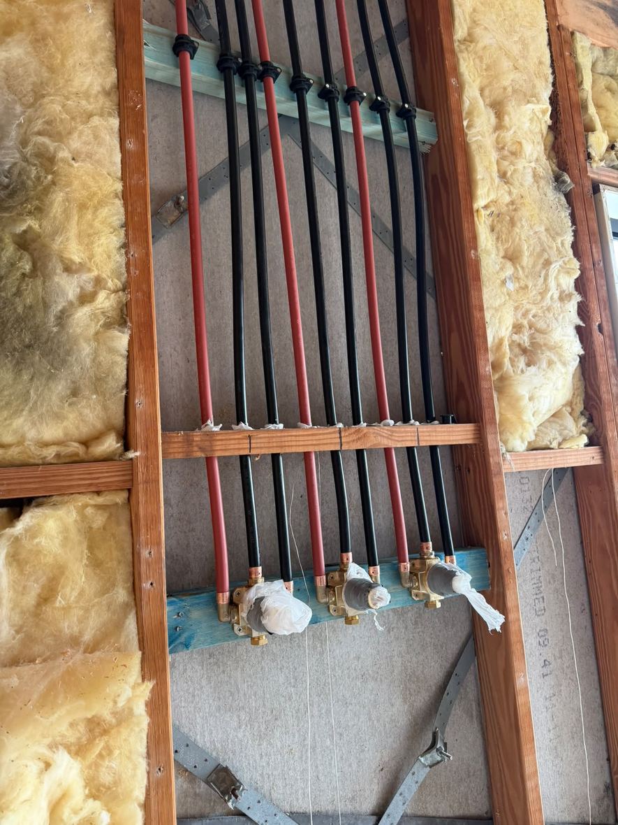 Hot and cold PEX landed on a mixer body before sheeting