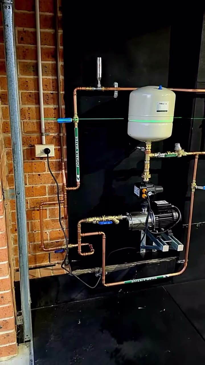 Mains-pressure pump and pressure vessel, isolation valves and potable labels.