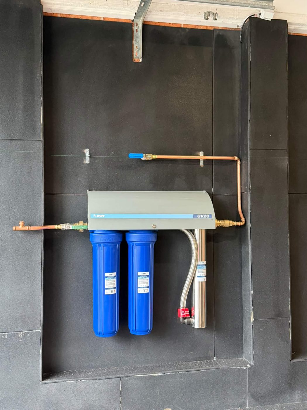 BWT UV20 steriliser over twin filter housings, teed off the copper bypass.