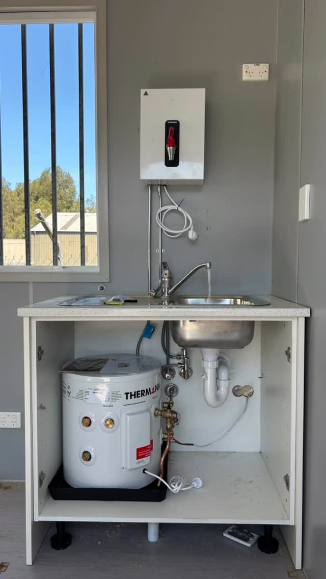 First-aid room kitchenette: stainless sink, mixer and under-bench Thermann storage
